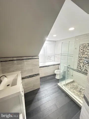 a kitchen with a sink and a stove top oven