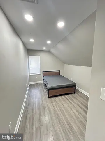 a room with wooden floor and furniture