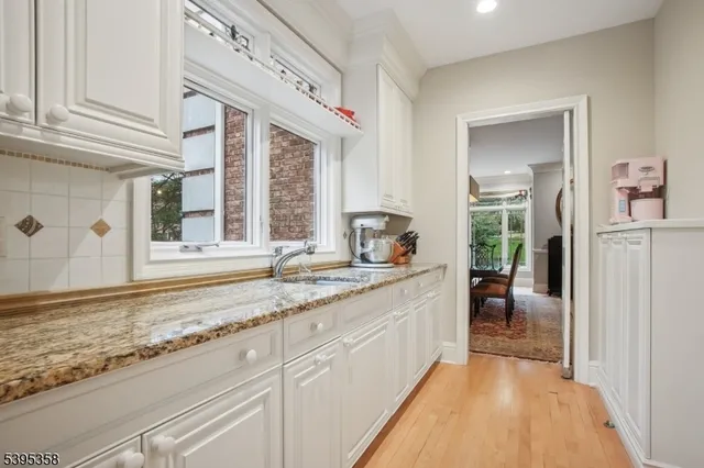 a dining room with furniture a chandelier and a rug