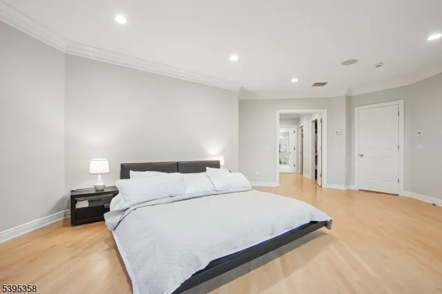 a bathroom with a sink a bathtub a mirror and a vanity