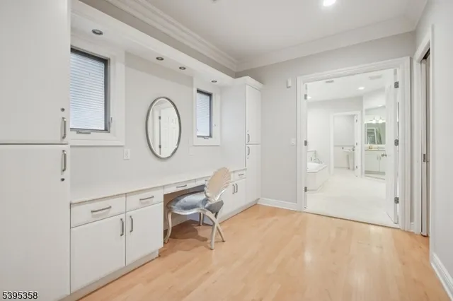 a bathroom with a tub sink shower and mirror