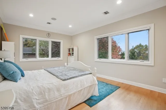a bedroom with furniture and a window