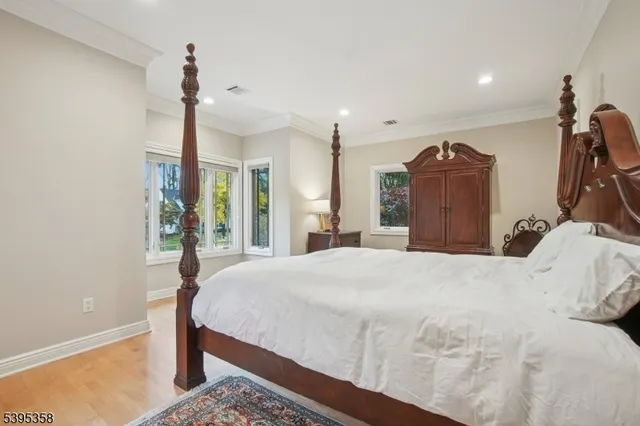 a spacious bedroom with a bed and a table in it