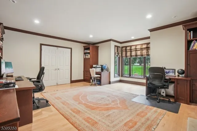 a large white kitchen with lots of counter space and a dining table