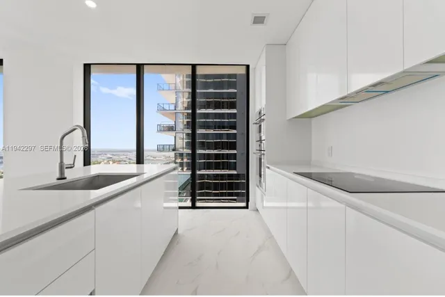 a kitchen with a sink and cabinets
