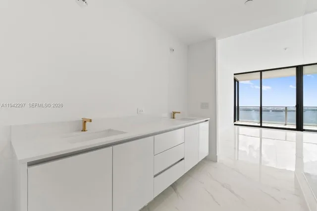 a bathroom with a sink and a large mirror