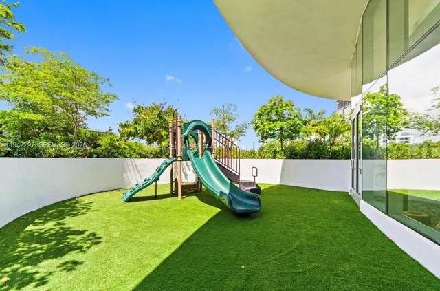 a view of a park with a slide