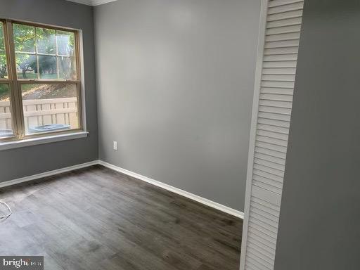 1785 Jonathan Way, Unit B Reston, VA 20190 - Photo 17 of 35 an empty room with wooden floor and windows