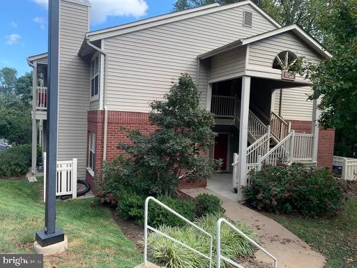 1785 Jonathan Way, Unit B Reston, VA 20190 - Photo 2 of 35 a front view of house with trees around