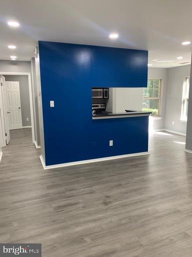 1785 Jonathan Way, Unit B Reston, VA 20190 - Photo 5 of 35 a view of kitchen with stainless steel appliances granite countertop a sink a stove and wooden floor