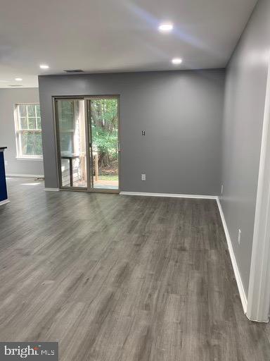 1785 Jonathan Way, Unit B Reston, VA 20190 - Photo 6 of 35 an empty room with wooden floor and windows