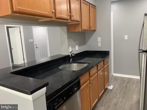 1785 Jonathan Way, Unit B Reston, VA 20190 - Photo 10 of 35 a kitchen with granite countertop a sink and cabinets