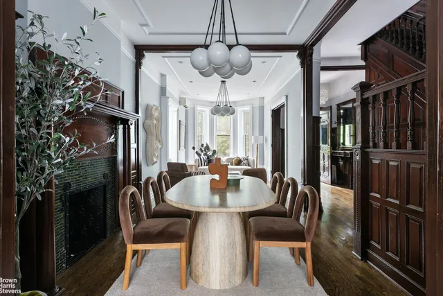 a dining room with furniture window and entryway