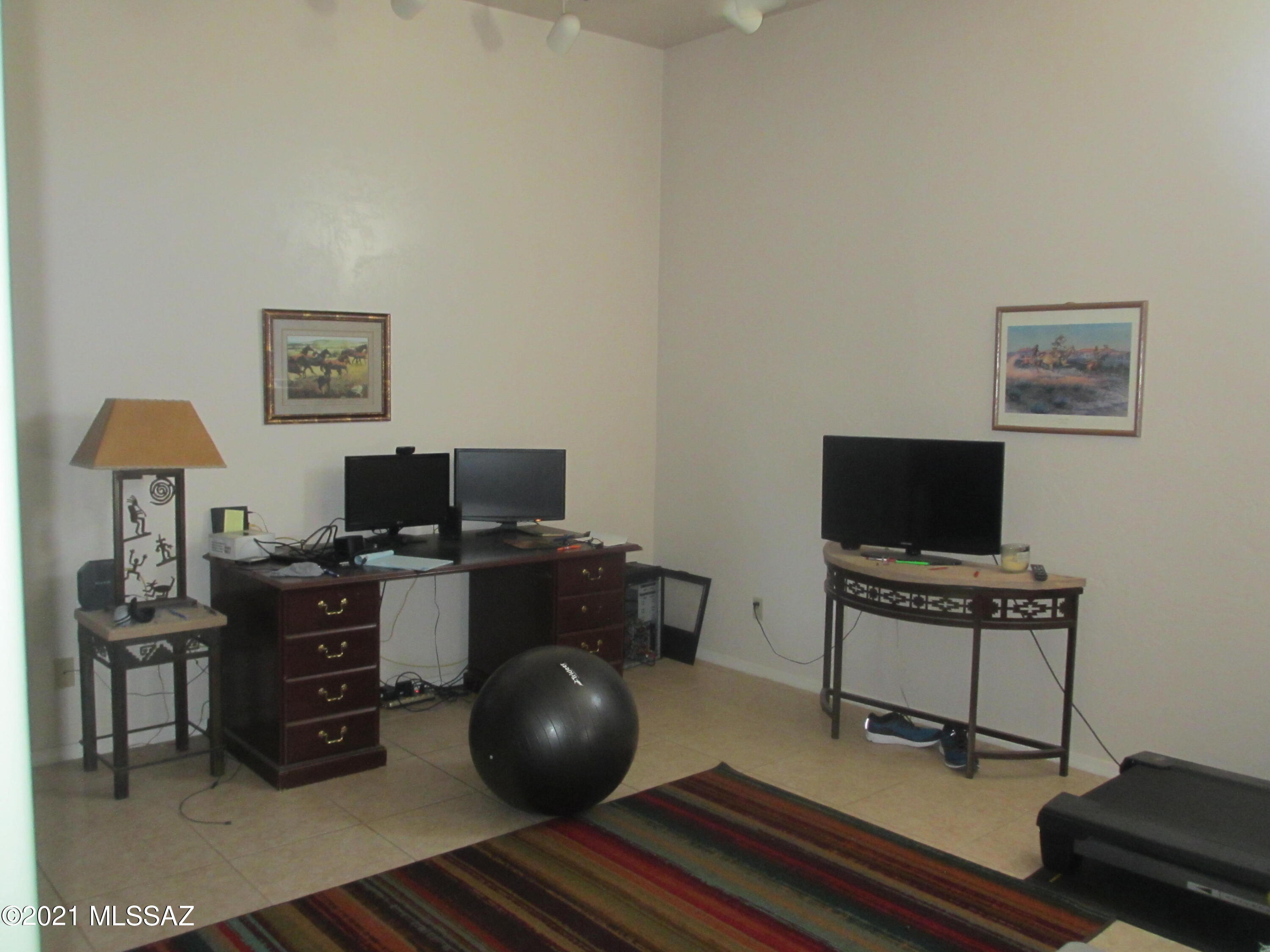978 Calle Amarillo Rio Rico, AZ 85648 - Photo 30 of 34 a view of a workspace with furniture and a window