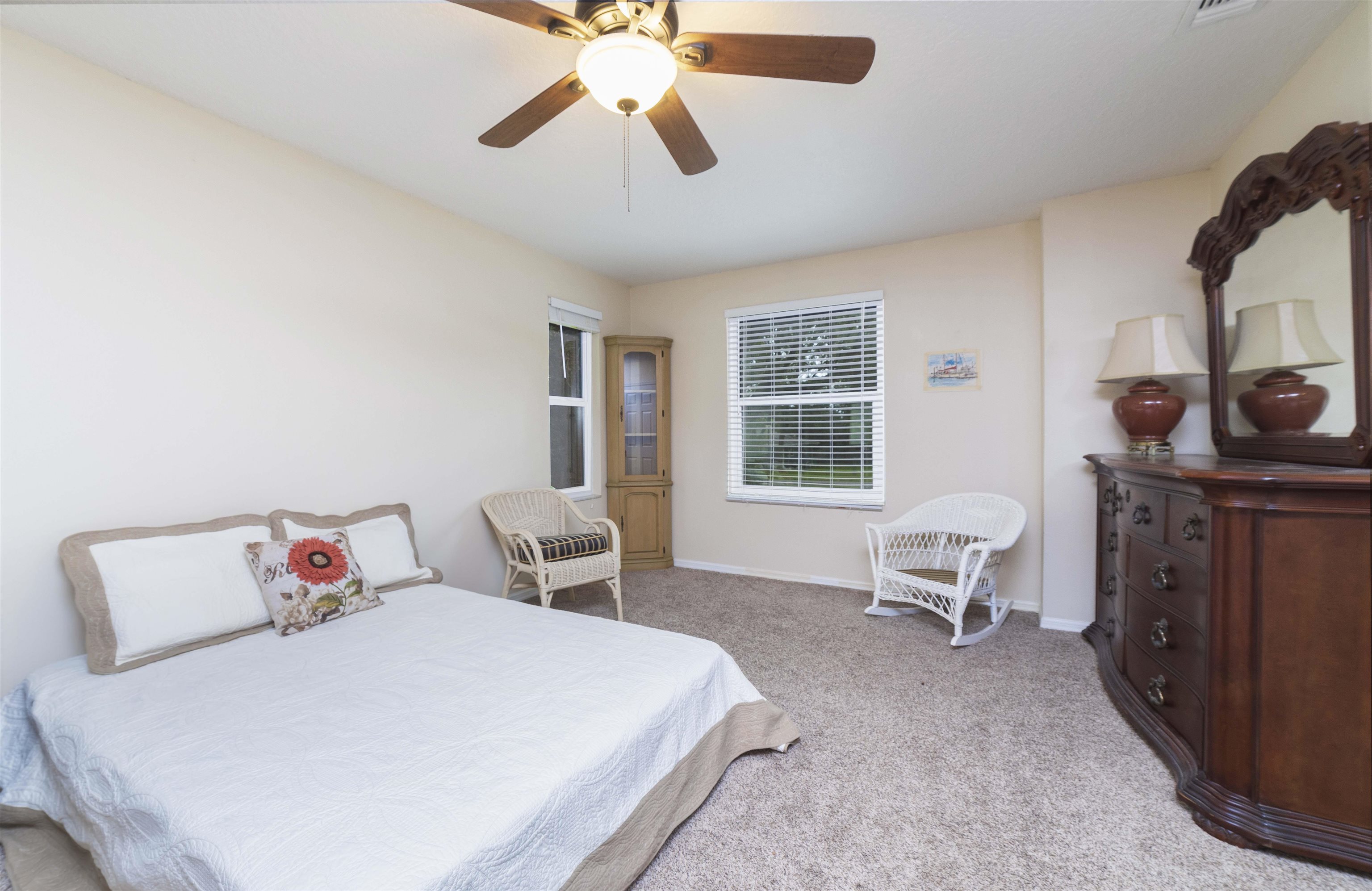208 Jasmine Road St. Augustine, FL 32086 - Photo 15 of 34 a bedroom with a bed and wooden floor