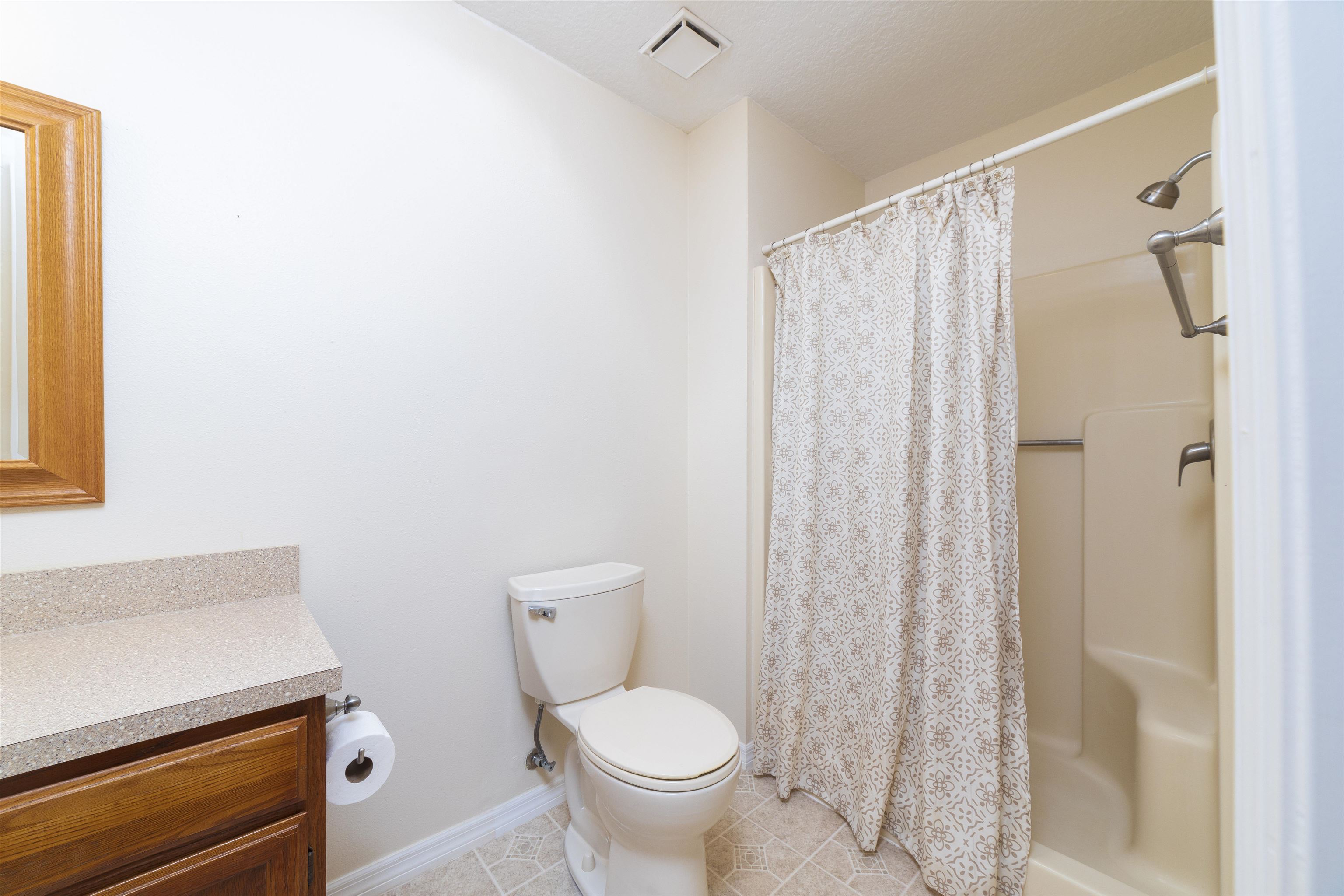 208 Jasmine Road St. Augustine, FL 32086 - Photo 22 of 34 a white toilet sitting next to a shower curtain