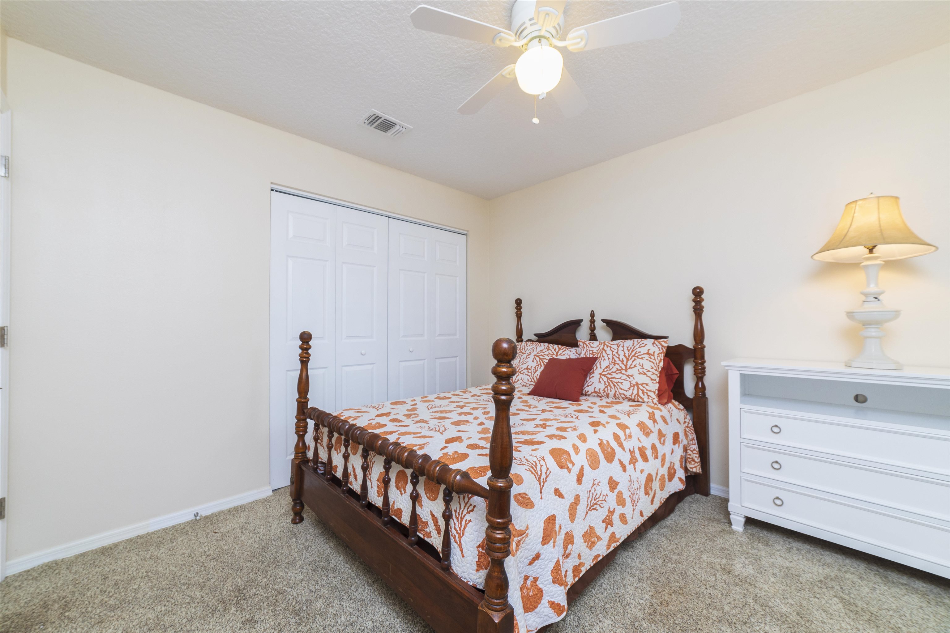 208 Jasmine Road St. Augustine, FL 32086 - Photo 23 of 34 a bedroom with a bed and a dresser