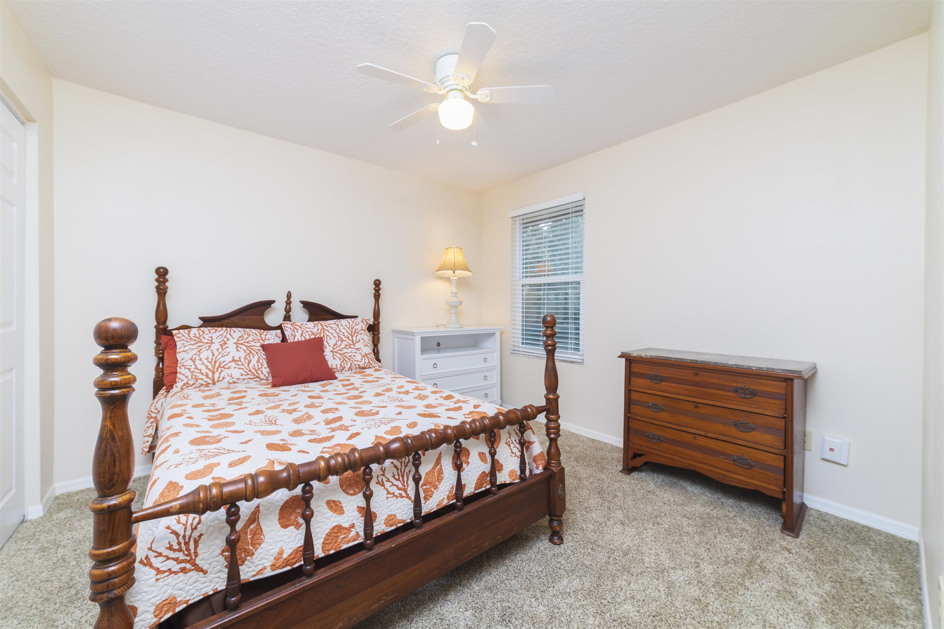 208 Jasmine Road St. Augustine, FL 32086 - Photo 24 of 34 a bedroom with a bed and a ceiling fan