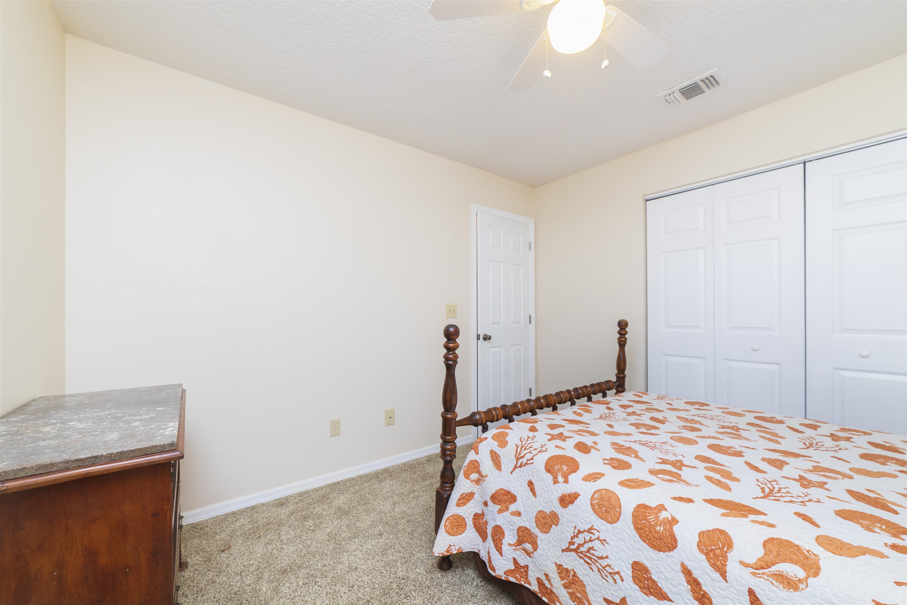208 Jasmine Road St. Augustine, FL 32086 - Photo 25 of 34 a bedroom with a bed and a dresser