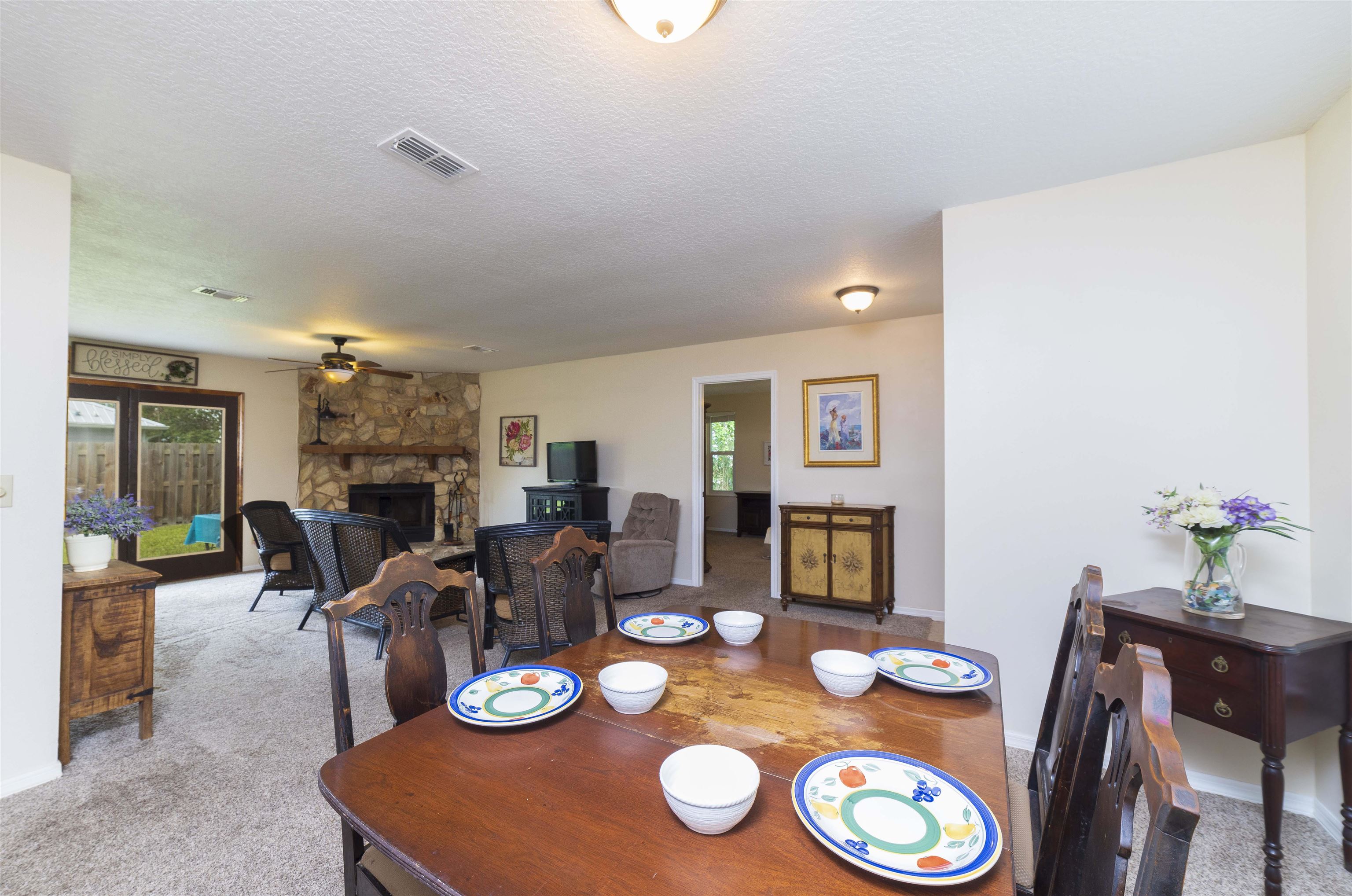 208 Jasmine Road St. Augustine, FL 32086 - Photo 8 of 34 a view of a dining room with furniture and wooden floor