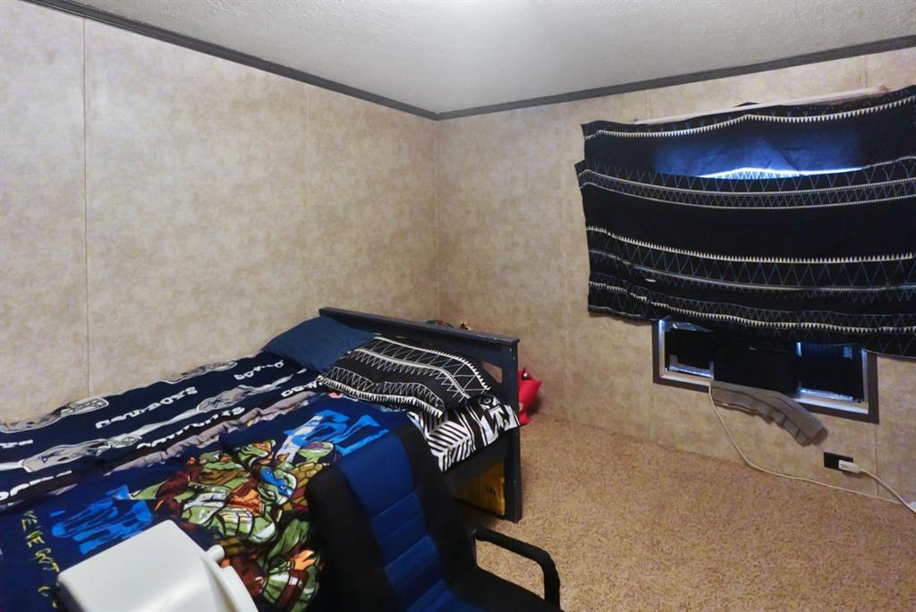 3108 Mistletoe Street Granbury, TX 76048 - Photo 11 of 15 a bedroom with a bed and a closet