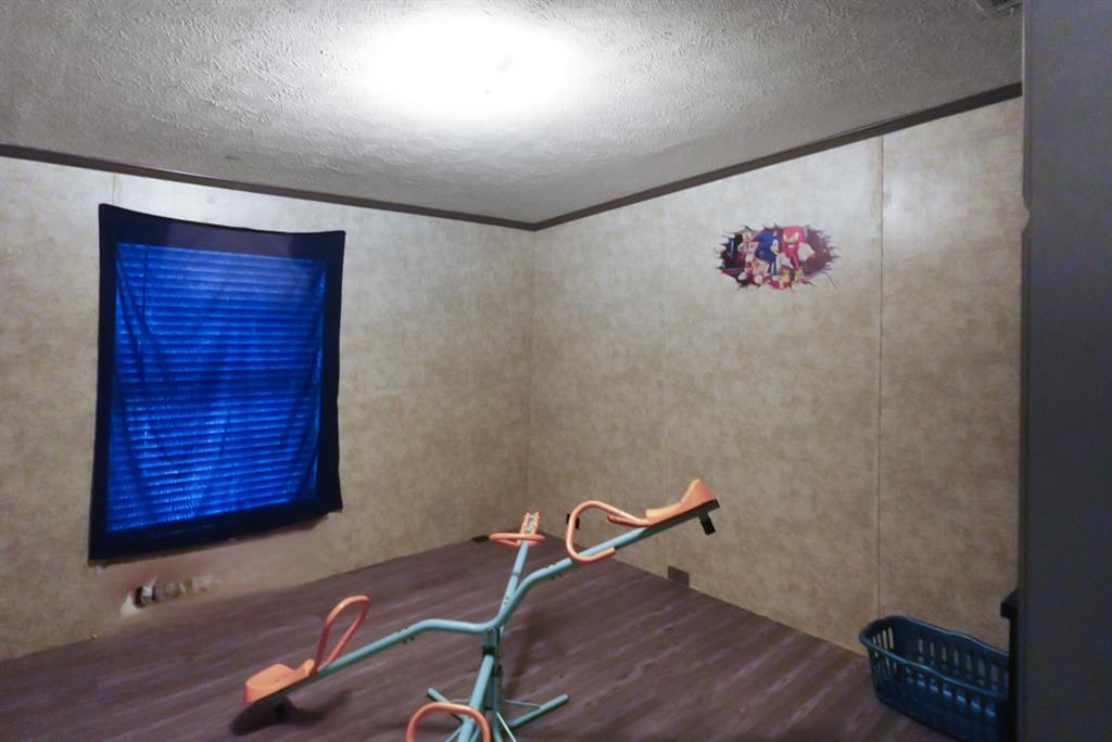 3108 Mistletoe Street Granbury, TX 76048 - Photo 13 of 15 a room with a table and a chair