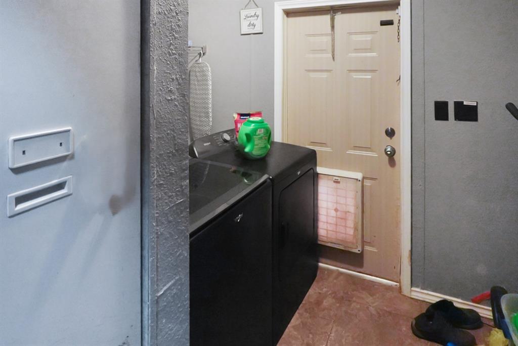 3108 Mistletoe Street Granbury, TX 76048 - Photo 14 of 15 a hallway with cabinets
