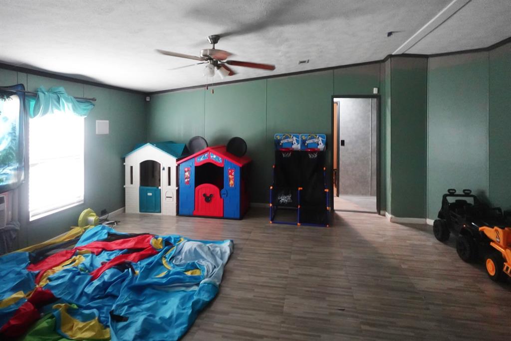 3108 Mistletoe Street Granbury, TX 76048 - Photo 9 of 15 a living room with furniture and flat screen tv