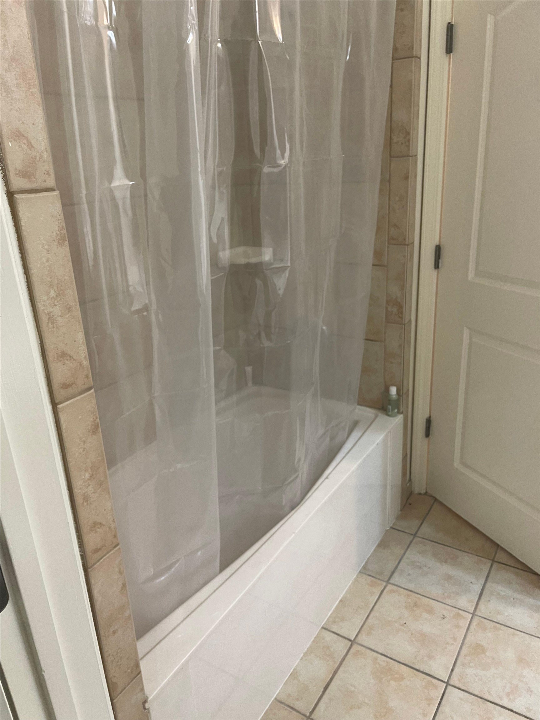 720 Litty Court, Unit 102 Memphis, TN 38103 - Photo 19 of 20 a bath tub sitting next to a shower