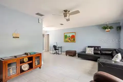 a view of a livingroom with workspace and a couch