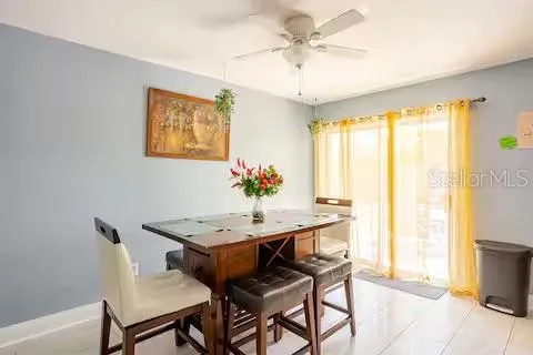 a dining room with furniture and window