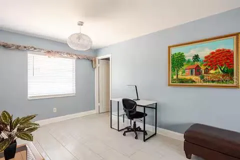 a bedroom with a bed and a chair