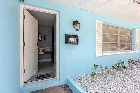 a room with a rug and a window