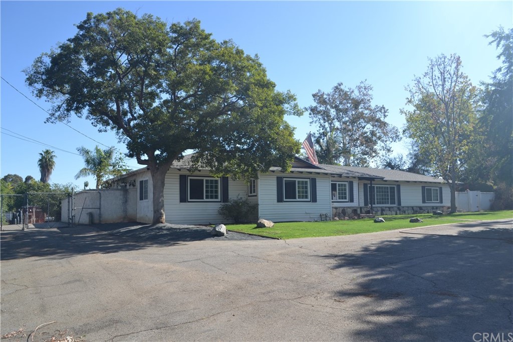 2223 Monroe Street Riverside, CA 92504 - Photo 1 of 1 a front view of a house with a yard