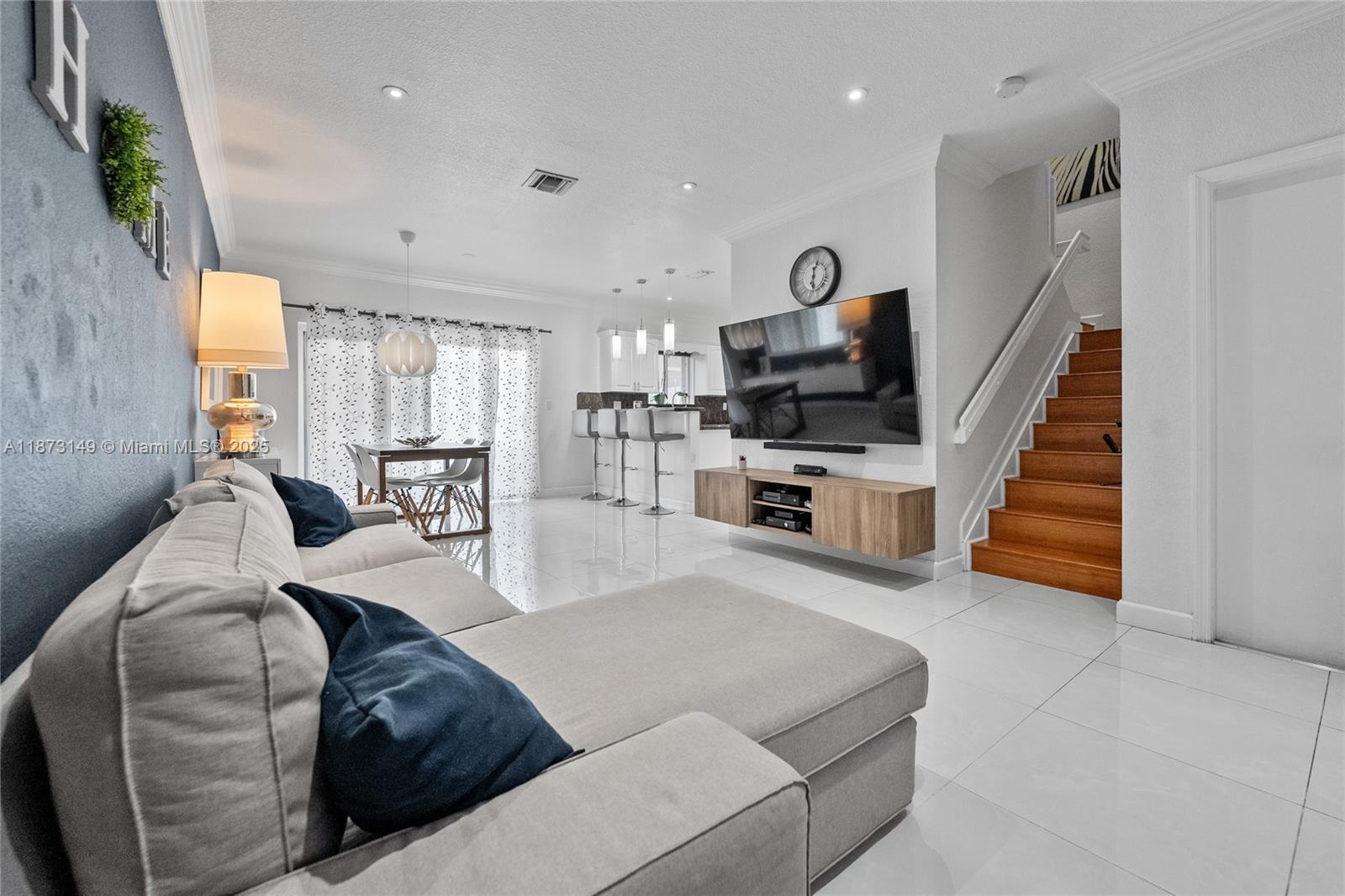 21474 Southwest 85th Path Cutler Bay, FL 33189 - Photo 1 of 30 a living room with furniture and a flat screen tv