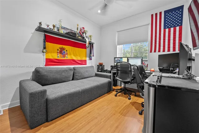 a living room with furniture projector and a workspace