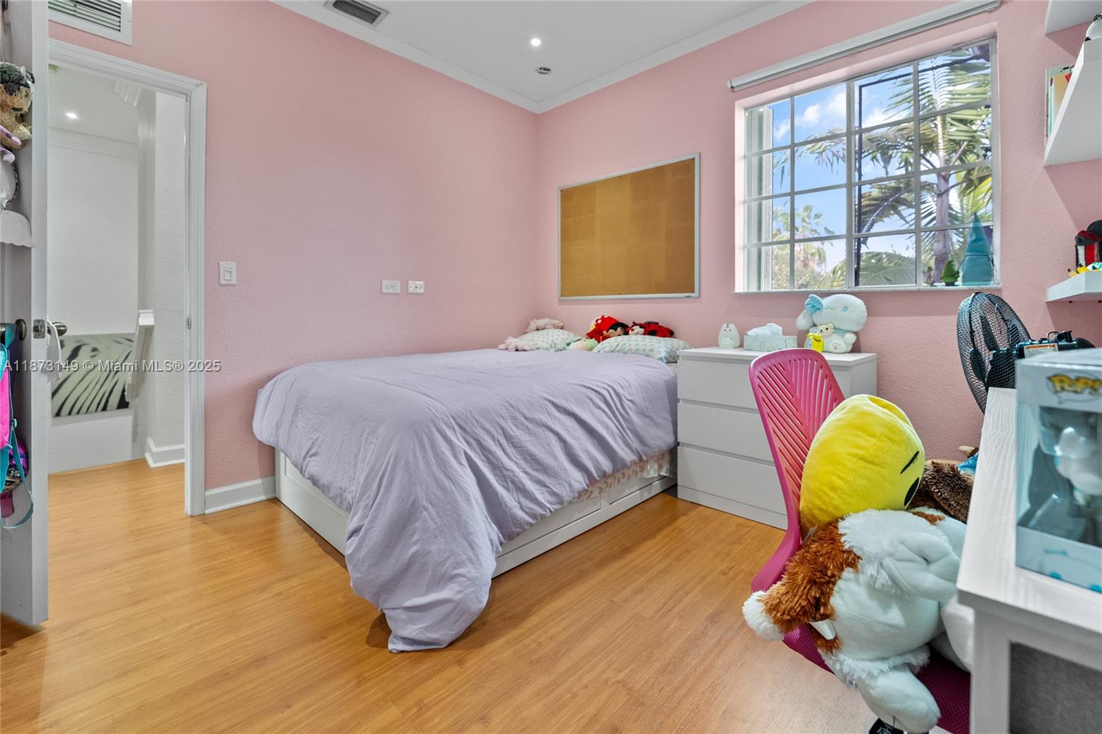 21474 Southwest 85th Path Cutler Bay, FL 33189 - Photo 22 of 30 a bedroom with a bed couch and a window