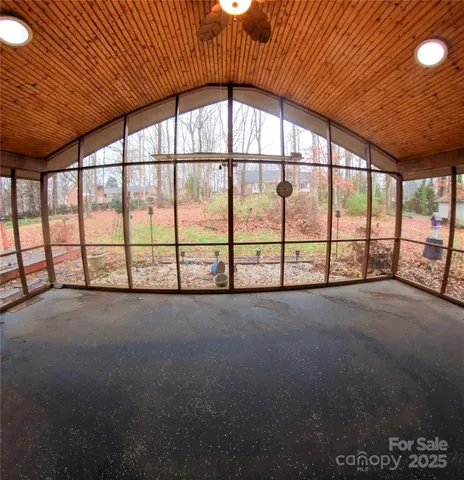 a view of an empty room with a large window