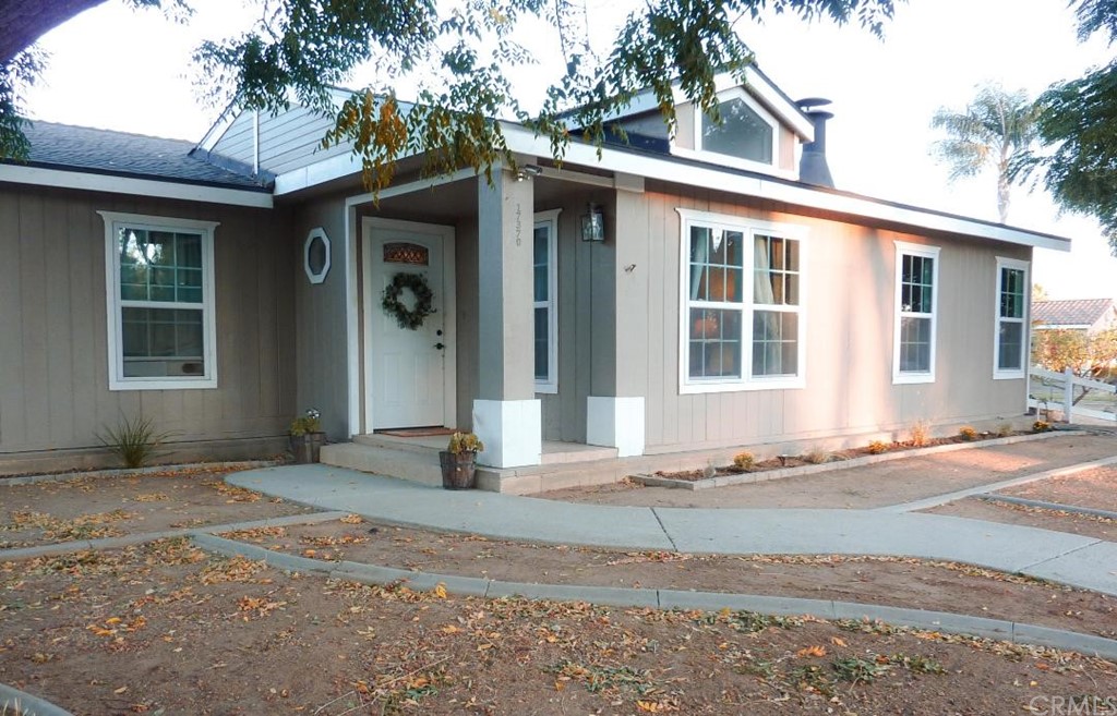 17370 Parsons Road Riverside, CA 92508 - Photo 1 of 1 a front view of a house with a yard
