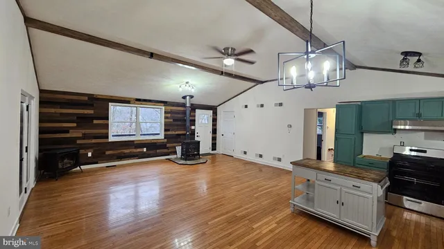 a view of a kitchen stove and cabinets