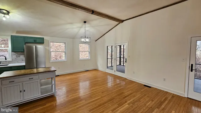a view of a kitchen cabinets and wooden floor