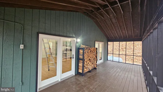 a view of front door with wooden floor