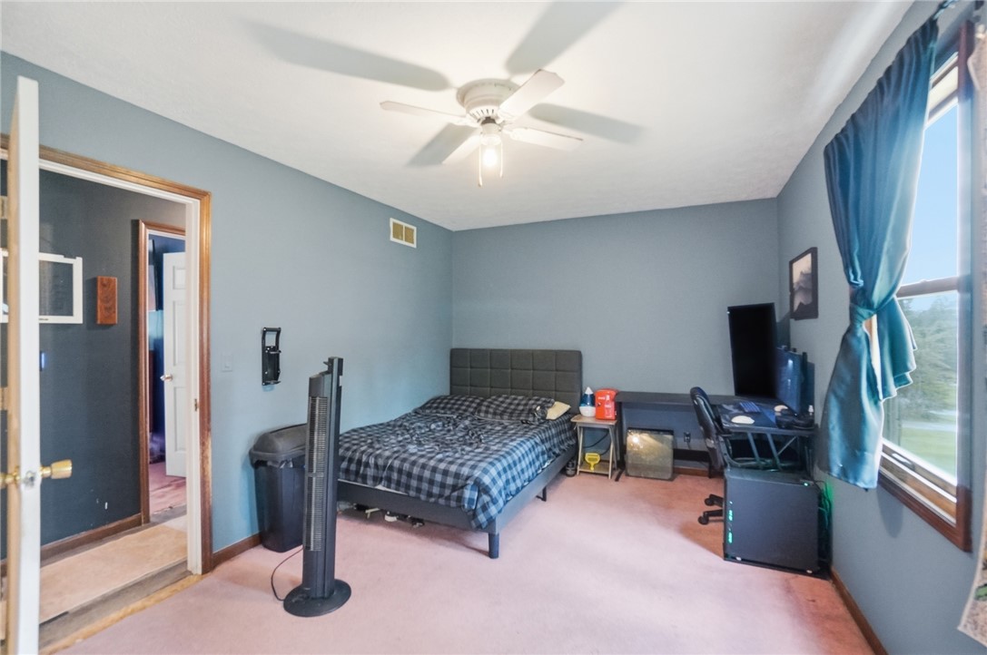 5209 North Addison New Carlisle Road St. Paris, OH 43072 - Photo 27 of 47 This spacious bedroom offers comfortable living with ample natural light.