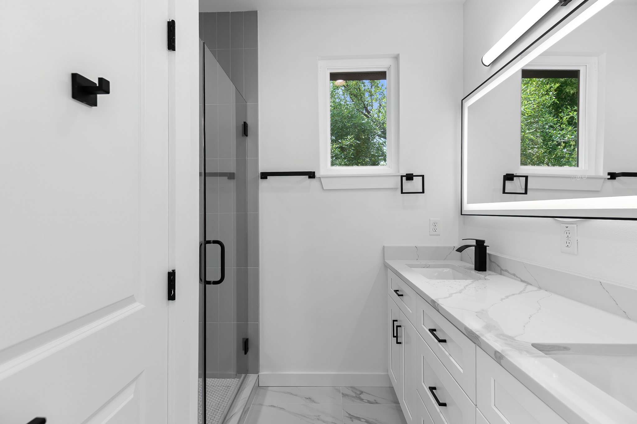 5305 Ledesma Road, Unit 4 Austin, TX 78721 - Photo 32 of 40 Clean lines and bright finishes create a modern aesthetic in this well-appointed bath.