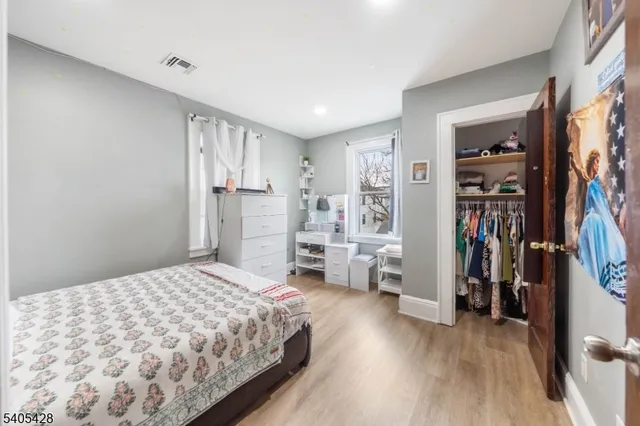 a bedroom with a large bed and a view of bedroom