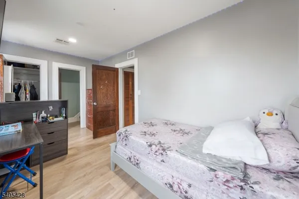 a bedroom with a bed and furniture