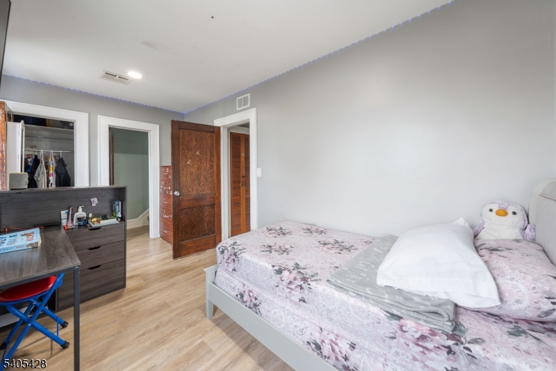 343 Dewitt Street Linden, NJ 07036 - Photo 14 of 33 a bedroom with a bed and furniture