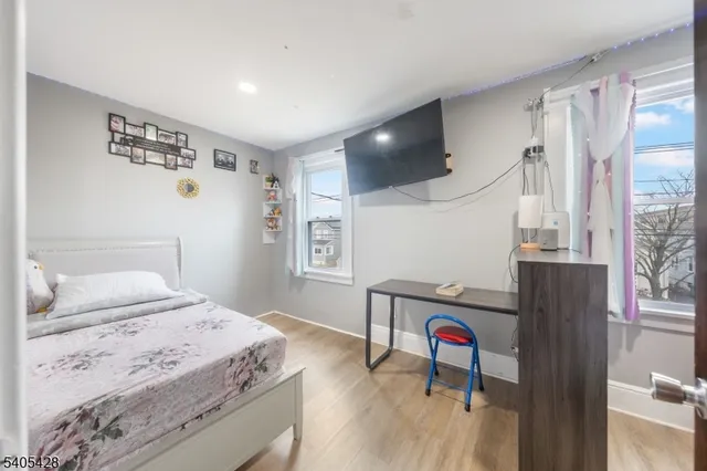 a living room with hard wood floors and a table