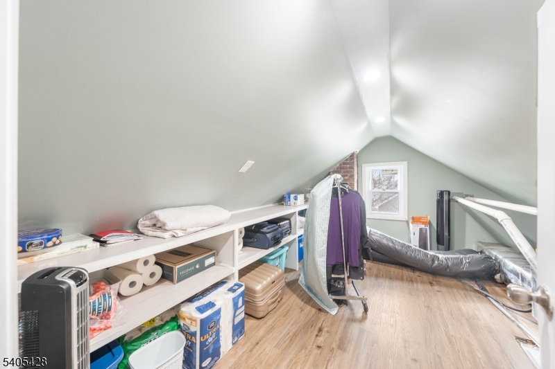 343 Dewitt Street Linden, NJ 07036 - Photo 16 of 33 a view of walk in closet with clothes and shoes