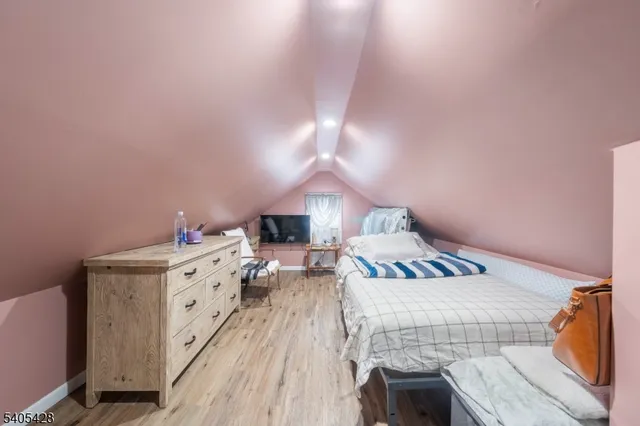 a bed room with a bed and a night stand